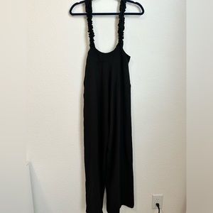 Cute black jumpsuit with pockets.